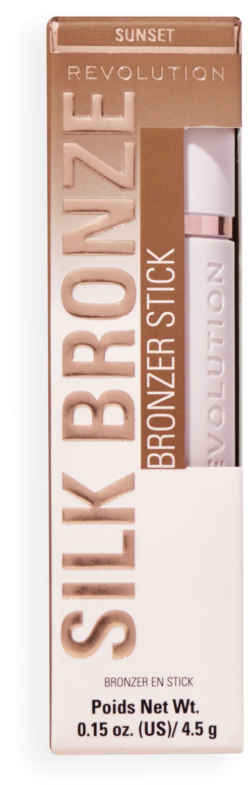 A box of Revolution Silk Bronzel stick with a white and rose design, showing the product inside. Contains 0.15 oz.