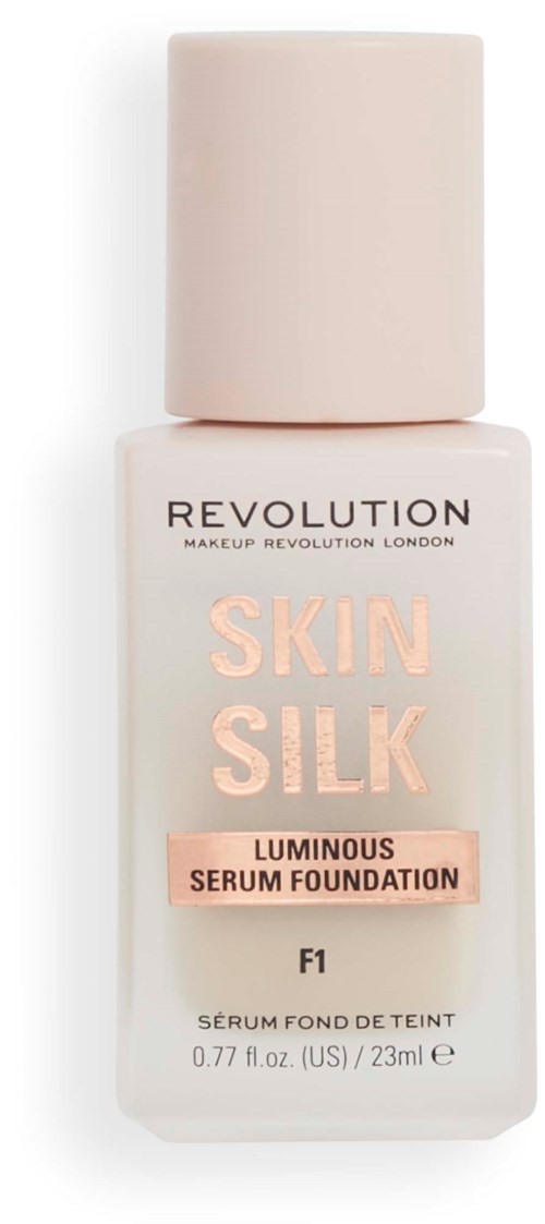 Een fles make-up foundation van Revolution met 'Skin Silk' label, roze dop en lichte kleurig lichaam.