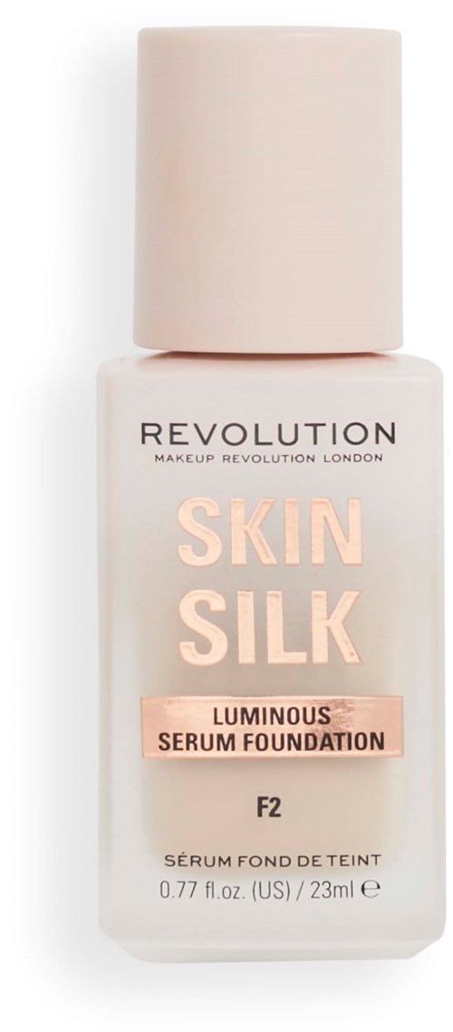 Bottle of Skin Silk Luminous Serum Foundation by Revolution, light pink and white bottle, with cream-colored cap.