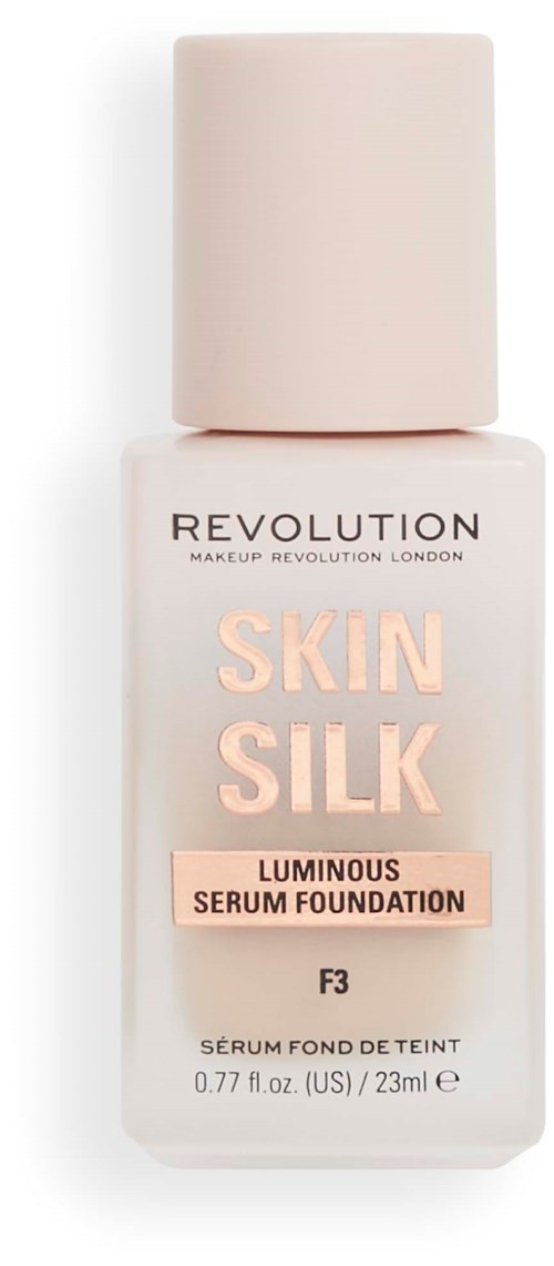 Een foundationfles met 'Skin Silk' label, lichtroze dop en eenvoudig ontwerp van Revolution Makeup London.