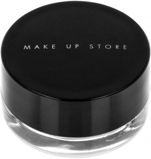 Ett runt glasbehållare med svart lock. Lockets har vit text som säger "MAKE UP STORE."