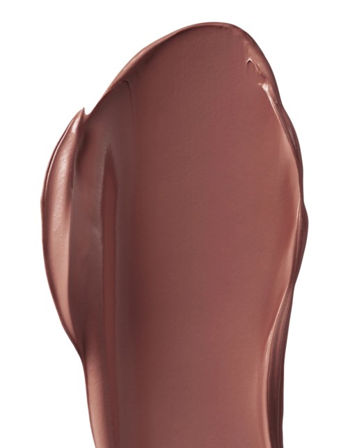 En brun, oljig och ojämn smet av vätska eller makeup på en vit bakgrund.