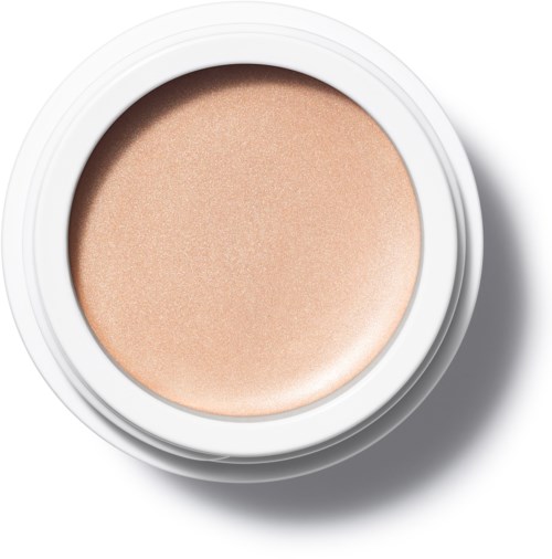En rund behållare med beige-färgad makeup inuti. Behållaren är vit och har en skugga på högra sidan.