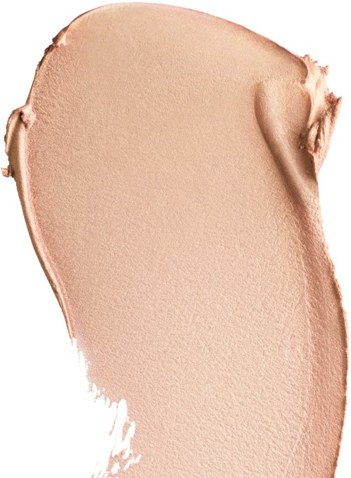 En beigefärgad kräm eller makeup som är utbredd ojämnt med vissa tjockare och tunnare områden.