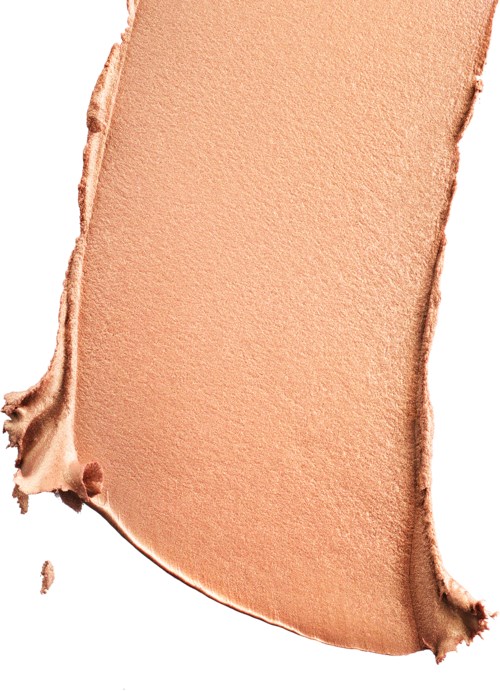 En provbit av beige eller ljusbrun makeup eller foundation med oregelbundna kanter.