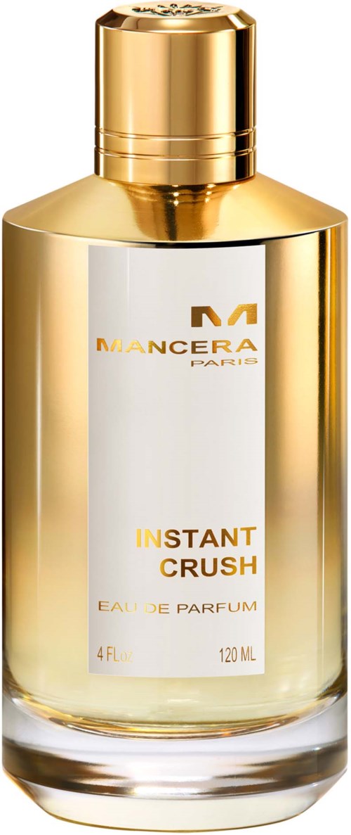 Een parfumfles met goud en wit ontwerp, gemarkeerd "Mancera Paris Instant Crush Eau de Parfum."