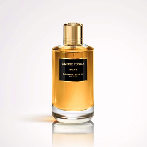 Een parfumfles met een gouden dop en zwart label. Het label zegt OMBRE TONKA MANCERA PARIS.