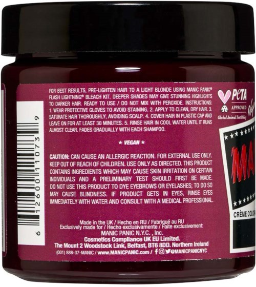 A small jar of hair dye with instructions and warnings on the label, including vegan and cruelty-free labels, and a black lid.