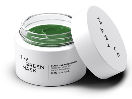 Offener Behälter mit grüne Gesichtsmaske und weißem Deckel, Etikett liest "The Green Mask."
