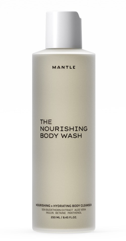Een lange, witte fles met de tekst 'The Nourishing Body Wash' en een witte dop.
