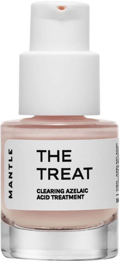 En liten glassflaska med vit pump innehåller ljusrosa vätska märkt 'THE TREAT'.