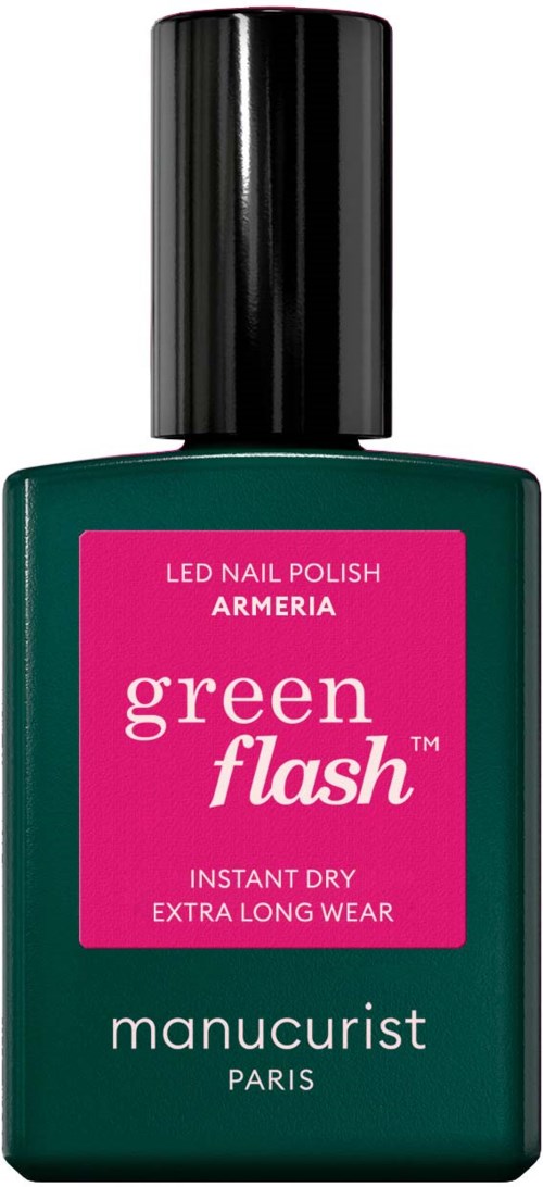 A bottle of green nail polish with a black cap, label says 'Green Flash' and 'Manucurist Paris'.
