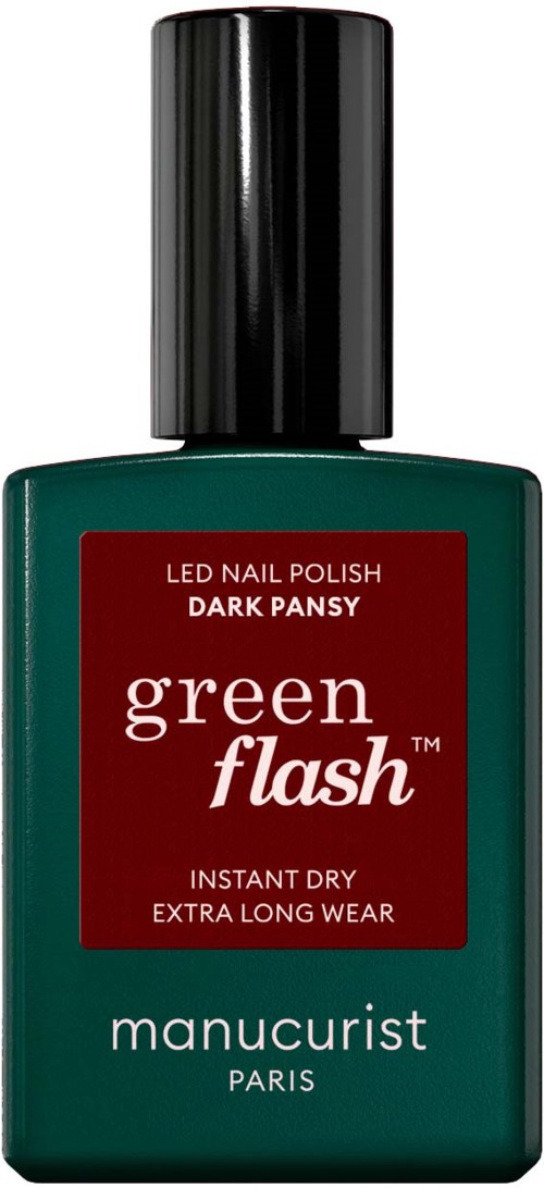 Dark green nail polish bottle with a black cap. Label says "Green Flash" and "Manucurist Paris."