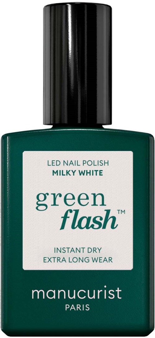 A green nail polish bottle with a black cap, labeled 'green flash,' 'manucurist,' and details about drying and wear.