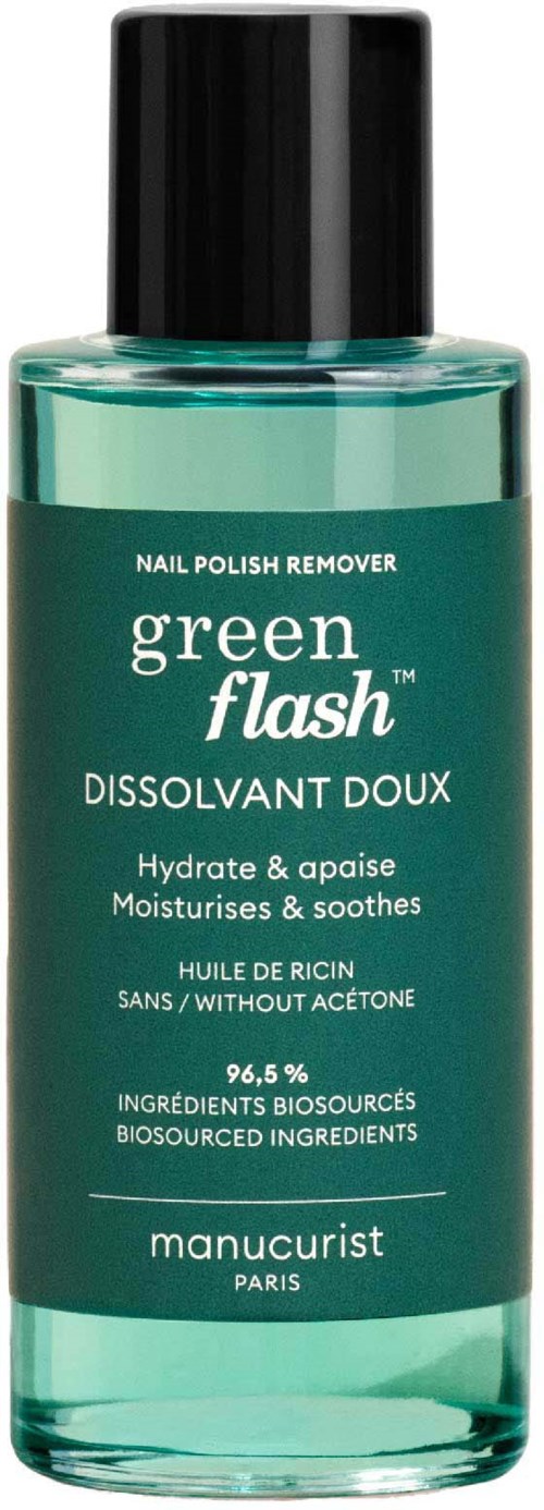 A green bottle of nail polish remover with a black cap, labeled in French and English, designed for moisturizing and soothing.