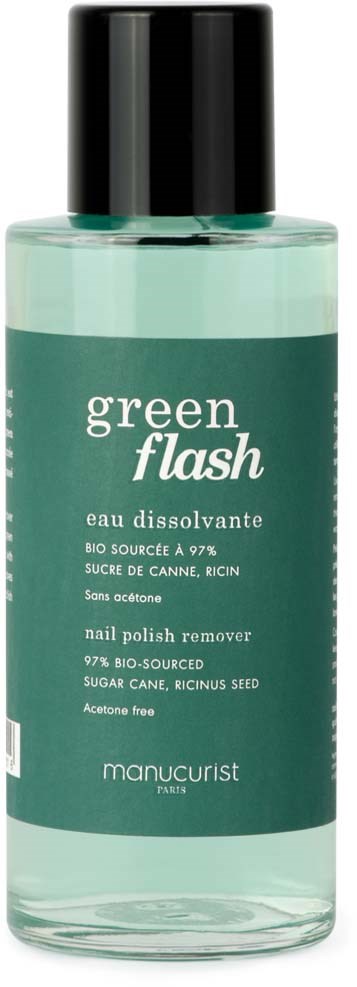 A clear bottle with a black cap, labeled 'green flash' nail polish remover, featuring green color and text details.