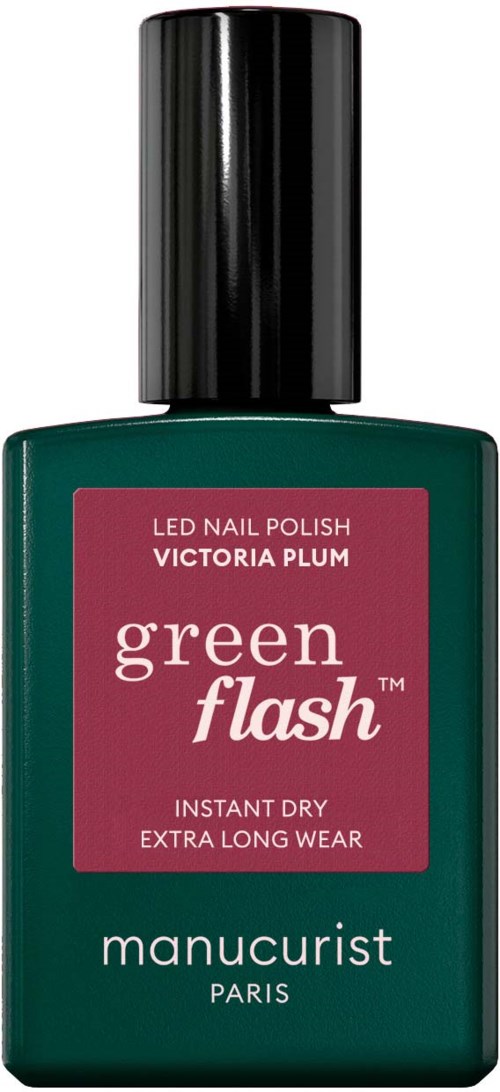 Green nail polish bottle with pink label, black cap, brand name 'Manucurist Paris'.