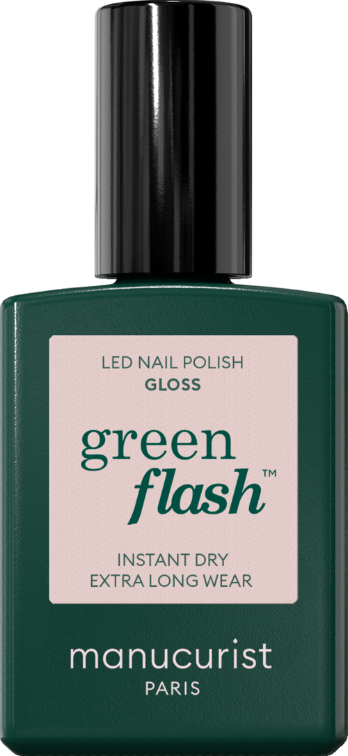 Green nail polish bottle with a black cap, label says 'Green Flash' and 'manucurist Paris,' with details about quick drying.