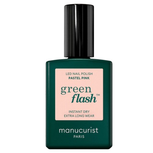 A green bottle of nail polish with a pink label that says Green Flash PASTEL PINK and Manicurist Paris.