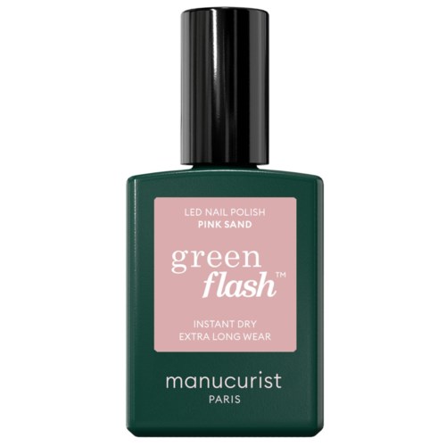 A green nail polish bottle with a black cap, labeled Pink Sand and Green Flash, by Manucurist Paris.