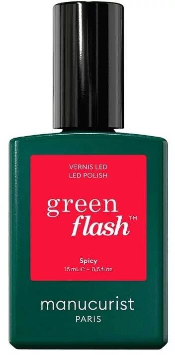 A green bottle of nail polish labeled green flash, spicy flavor, by manucurist Paris.