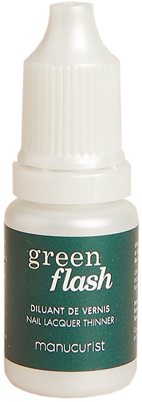 A small white bottle with a green label saying "green flash" and "manucurist". It is nail polish thinner.