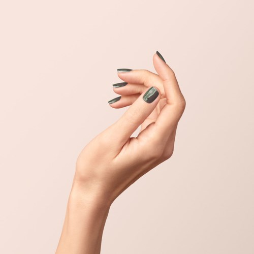 A hand with dark gray painted nails is shown against a plain background.