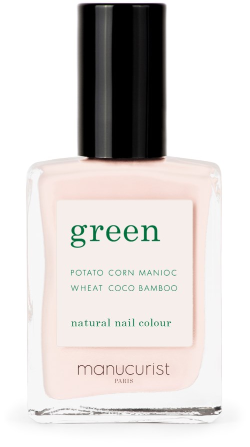 A nail polish bottle with a white label says "green" and lists natural ingredients like potato, wheat, coconut, and bamboo.