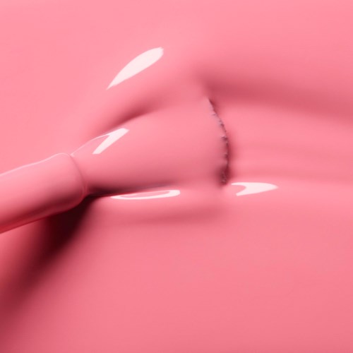 Pink object with a small hole, looking like a soft, stretchy material.