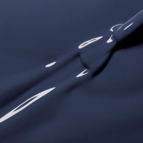 A pen writes on a dark, smooth surface, creating white ink marks.