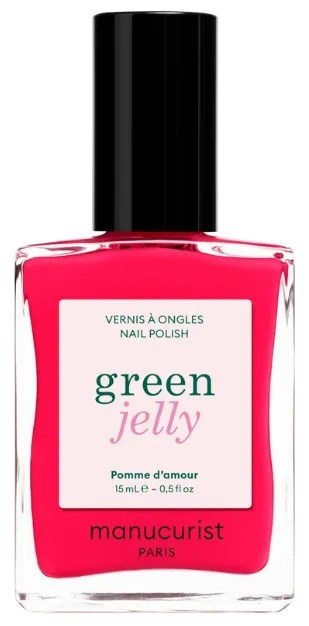 A bottle of pink nail polish labeled Green Jelly by Manucurist. It has a black cap and a white label.
