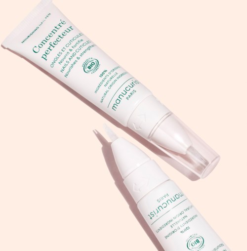 Two white skincare tubes with green text, one slightly above the other, against a light background.