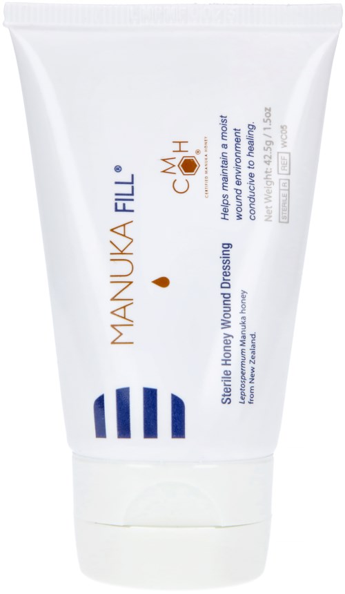 A white tube with blue and brown text, used for wound dressing with honey and herbal ingredients.
