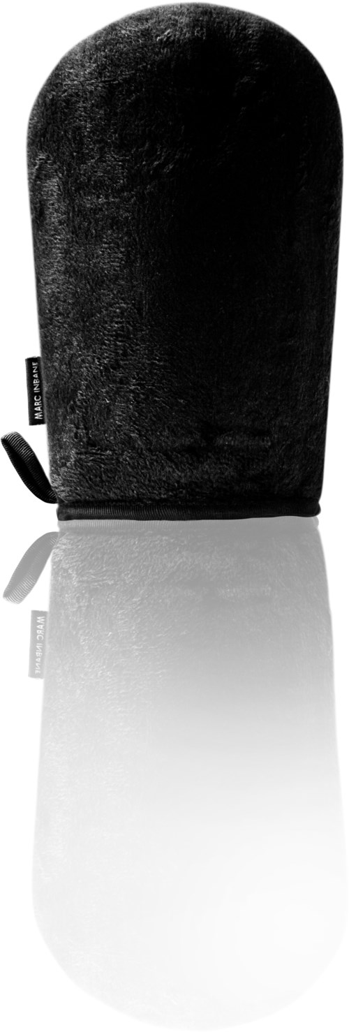 A black, oval-shaped object with a small strap on the side, reflecting on a surface.
