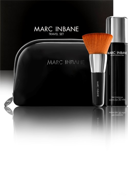 A black travel set box with a brush and spray bottle, labeled Marc Inbane.