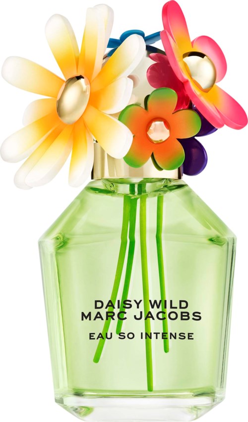 Kleurrijke kunstmatige bloemen in een groene parfumfles met zwarte tekst.