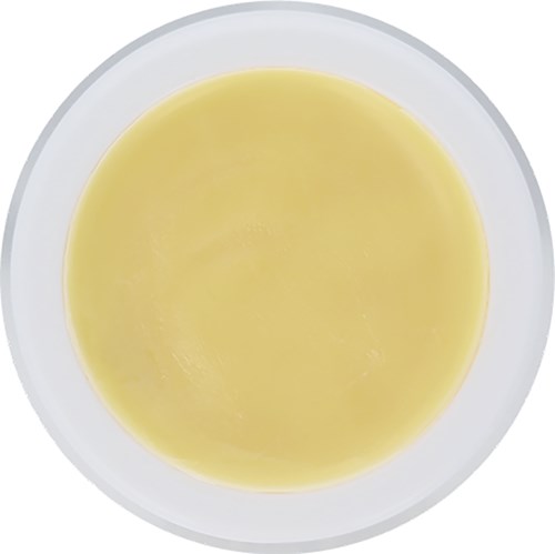 Eine Schüssel mit gelber Flüssigkeit, wahrscheinlich Suppe oder Sauce, von oben.