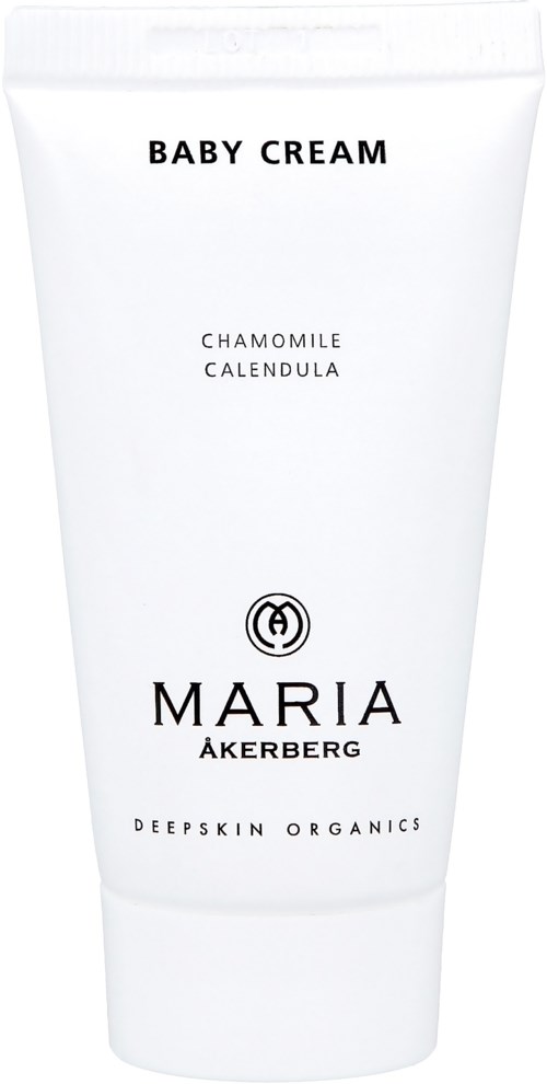 En vit tub med babykräm med svart text, med ingredienserna kamomill och ringblomma, av Maria Åkerberg.