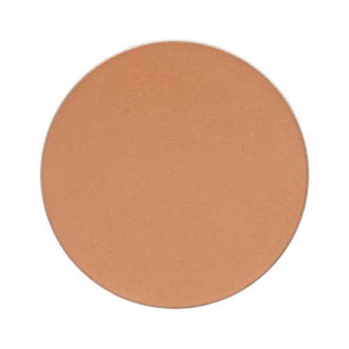 En flat, rund, beige makeup-pudder. Ingen annen gjenstand eller detalj er synlig i bildet.