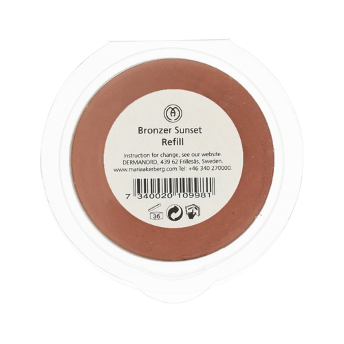 A round container of bronzer makeup called 'Bronzer Sunset Refill' with a label showing instructions and a barcode.