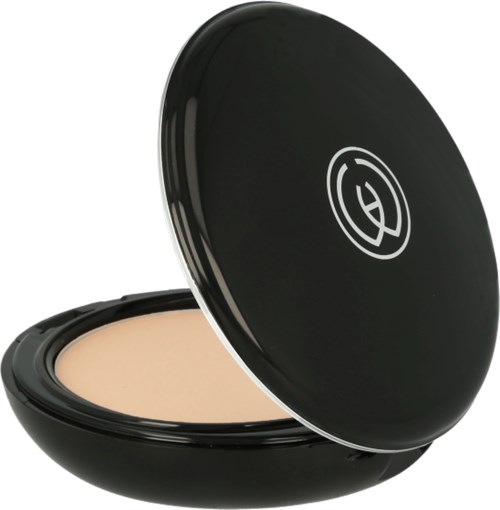 A compact powder case with a beige pressed powder inside and a black lid with a white logo.