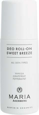 A white roll-on deodorant bottle labeled 'Sweet Breeze' with scents of vanilla, grapefruit, and peppermint.