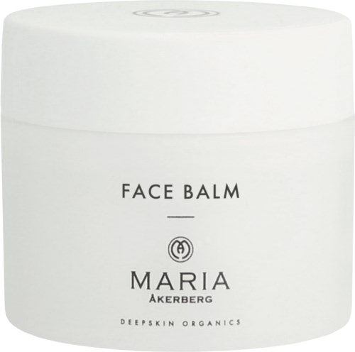 Een witte pot met de tekst 'Face Balm Maria Akerberg' in eenvoudige zwarte letters en een klein logo.