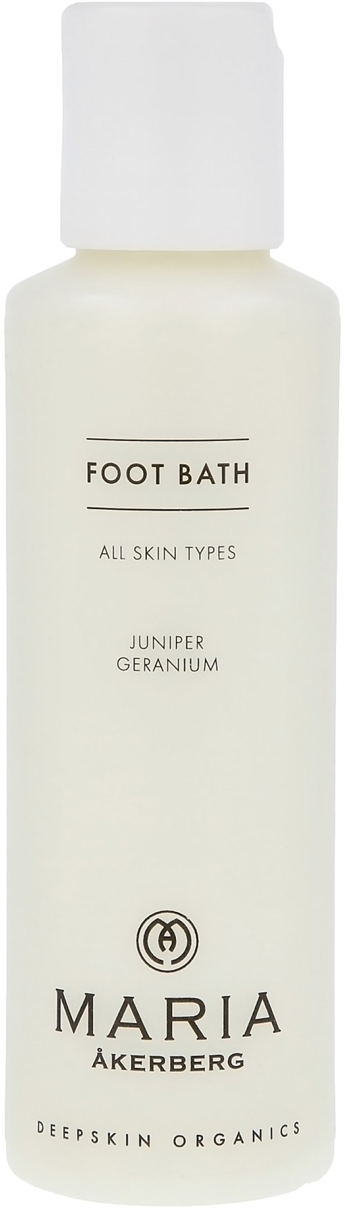En vit flaska märkt 'Foot Bath' med naturliga ingredienser, lämplig för alla hudtyper, av Maria Åkerberg.