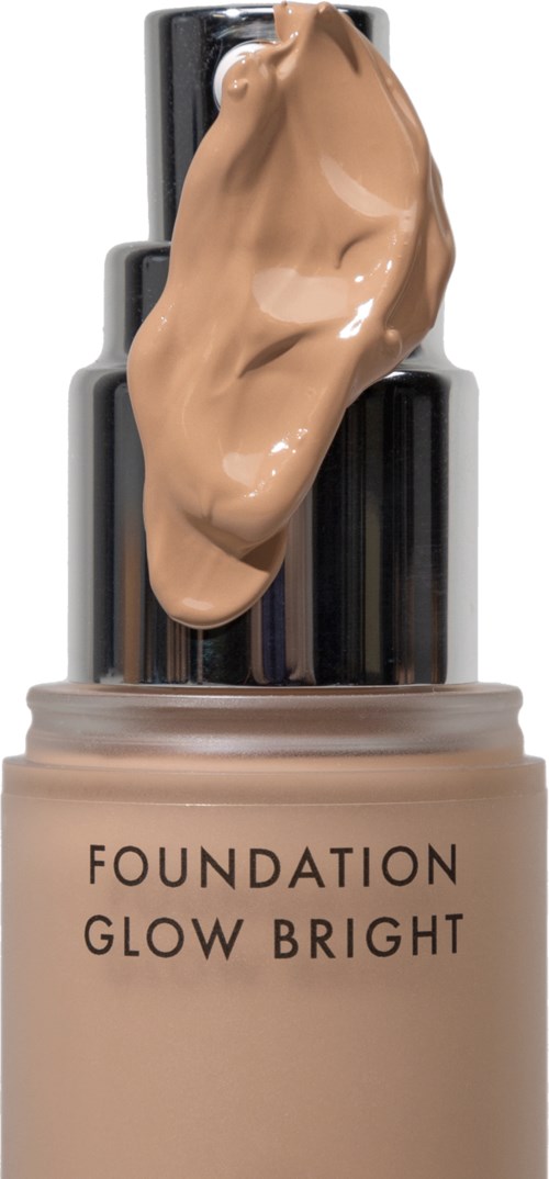 Eine Flasche Make-up mit beigefarbener Grundierung und Produkt auf dem Applikator.