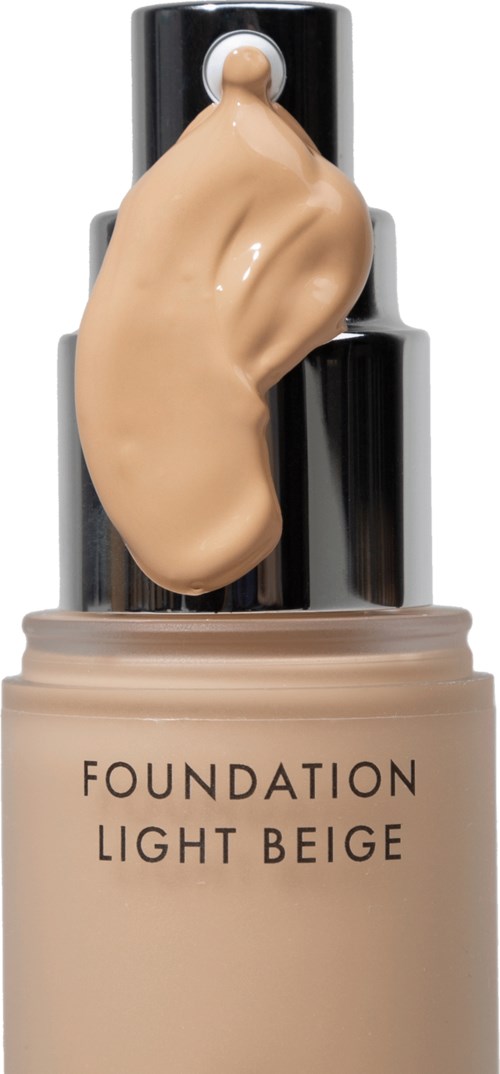 Eine Flasche Foundation mit "Light Beige" aufschrift und beige Flüssigkeit oben.