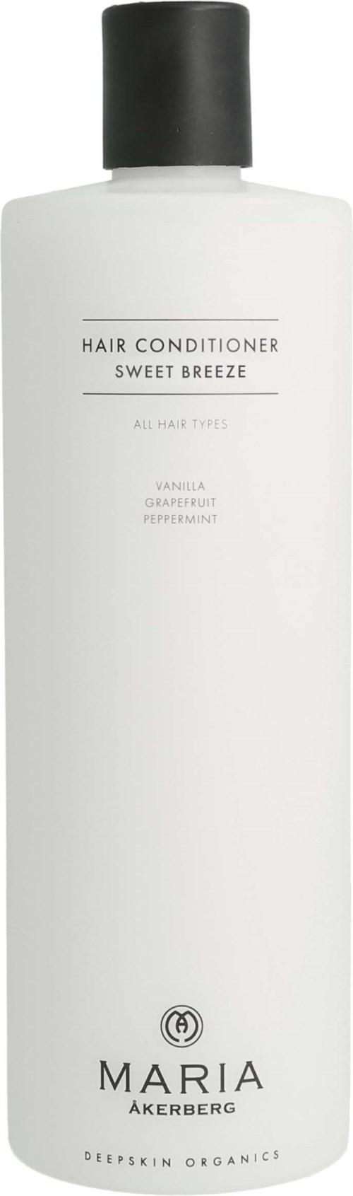 A white bottle of hair conditioner called Sweet Breeze, with a black cap, made by Maria Åkerberg, organic and for all hair types.