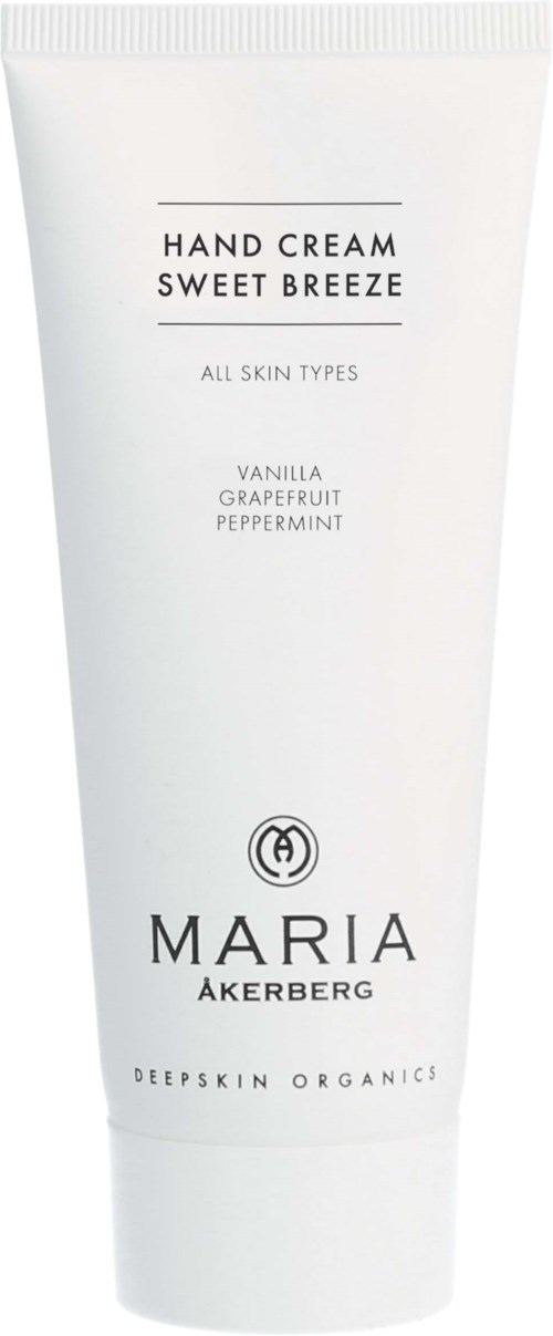Eine weiße Tube Handcreme mit "Sweet Breeze" Duft, Vanille, Grapefruit, Pfefferminze von Maria Åkerberg.