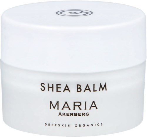 Ein weißer Behälter mit Shea Balm Maria Akerberg, hergestellt von Deepskin Organics, für Hautpflege.