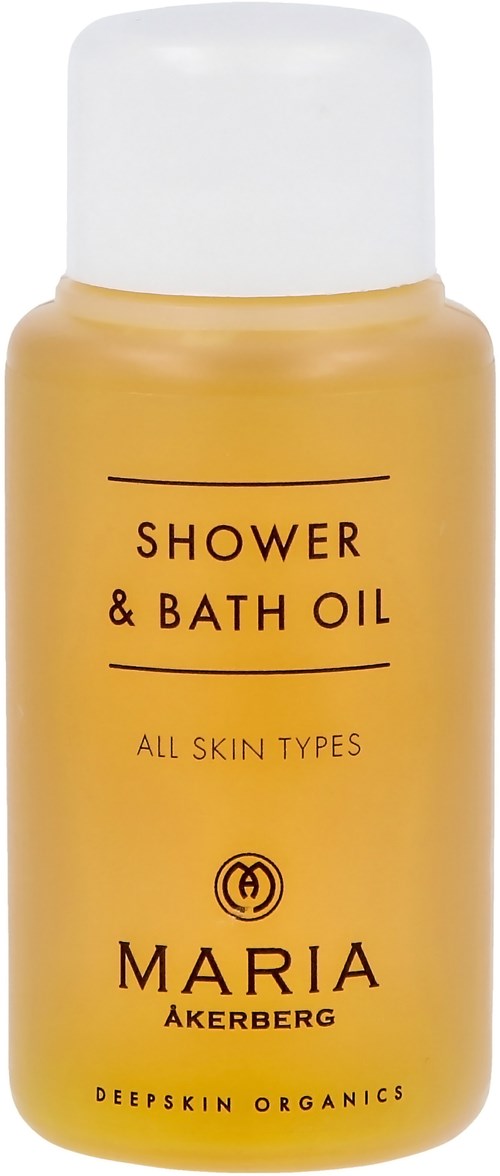 Gelbe Flasche mit 'Shower & Bath Oil' für alle Hauttypen von Maria Akerberg.